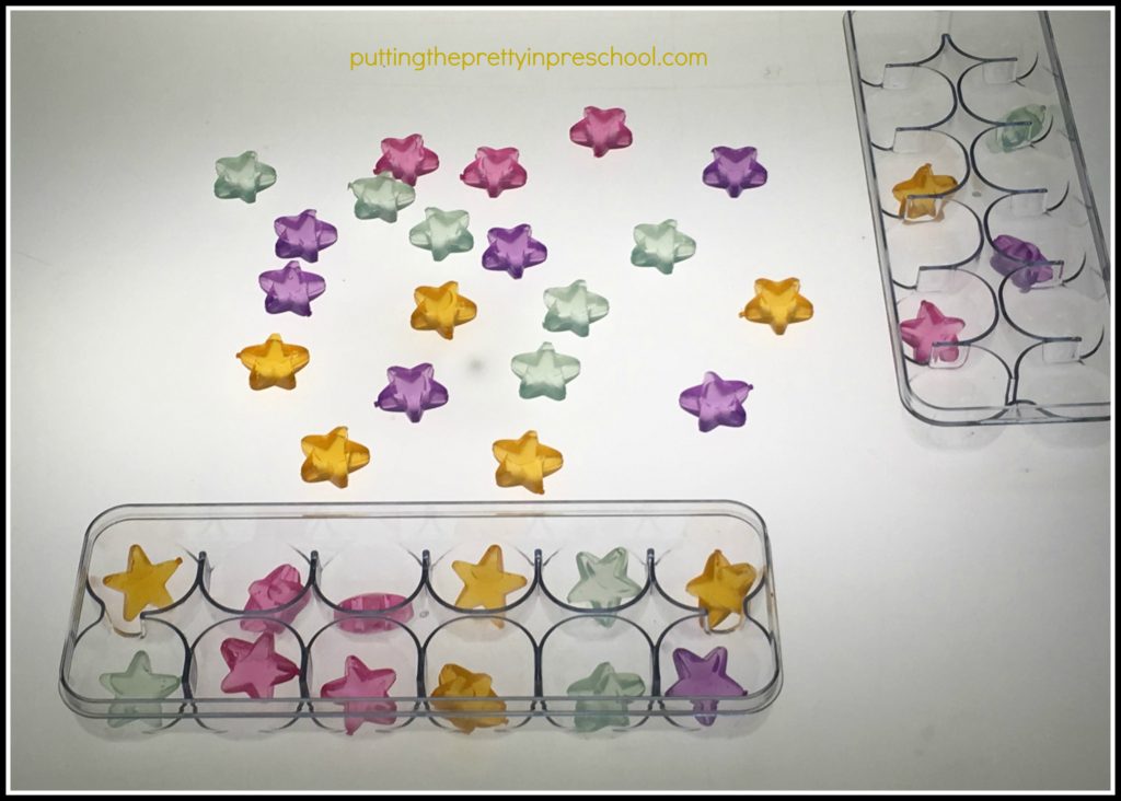 Transparent star shaped ice cubes to sort at a light table.