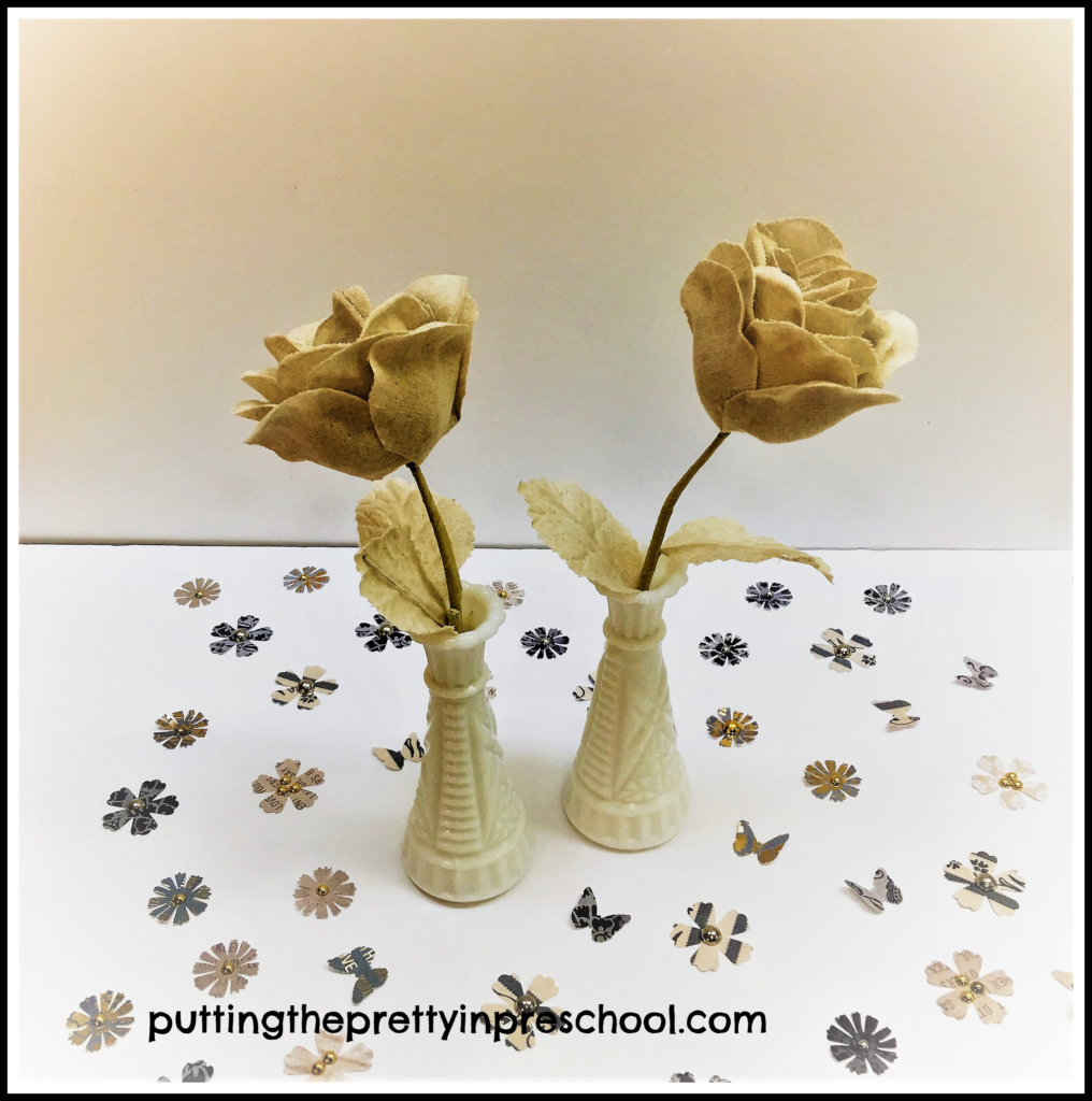 Tan denim cloth flowers and butterfly and flower table scatter.