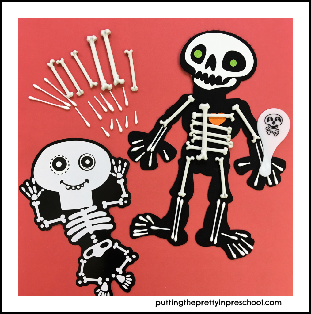 Felt skeleton decorated with plastic and Q-Tip bones. A cardboard skeleton serves as a model.