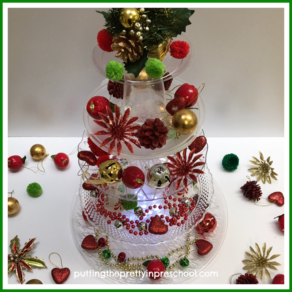 A decorated tower tree using clear plastic plates, serving trays, and cups. A STEAM activity for young learners.