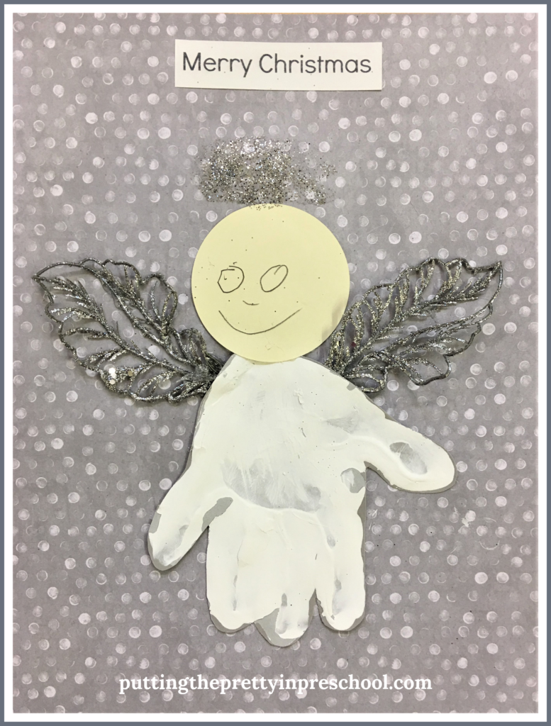 Handprint angel craft with the caption "Merry Christmas." An easy to make keepsake all children can create.