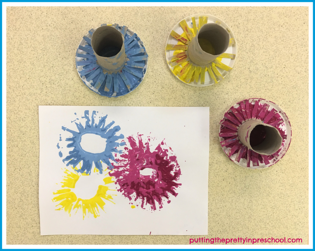 Practice making paint print fireworks on a piece of scrap paper before making prints on the Happy New Year printable.