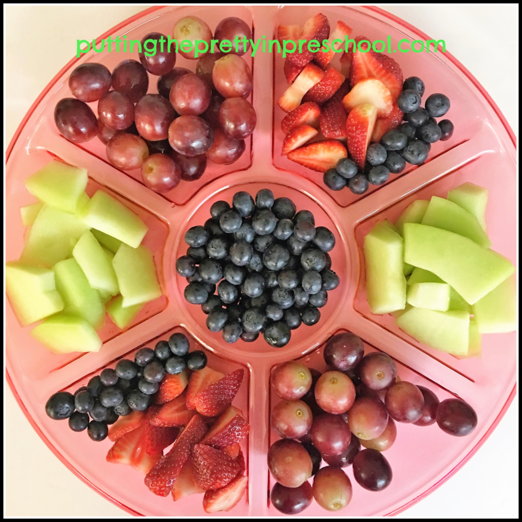 Fruit tray with strawberries, blueberries, grapes and honeydew.