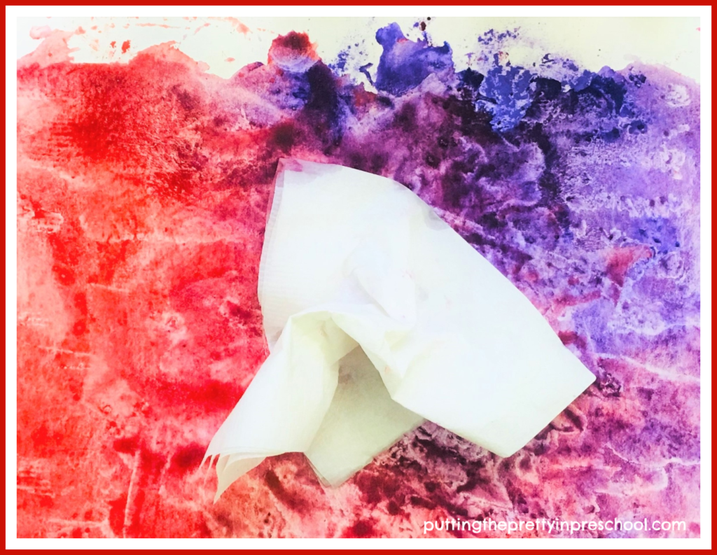 Ice cube and powder paint technique. If the paper is very wet, some watery color can be dabbed off with a scrunched-up napkin. This adds texture and depth to the project.