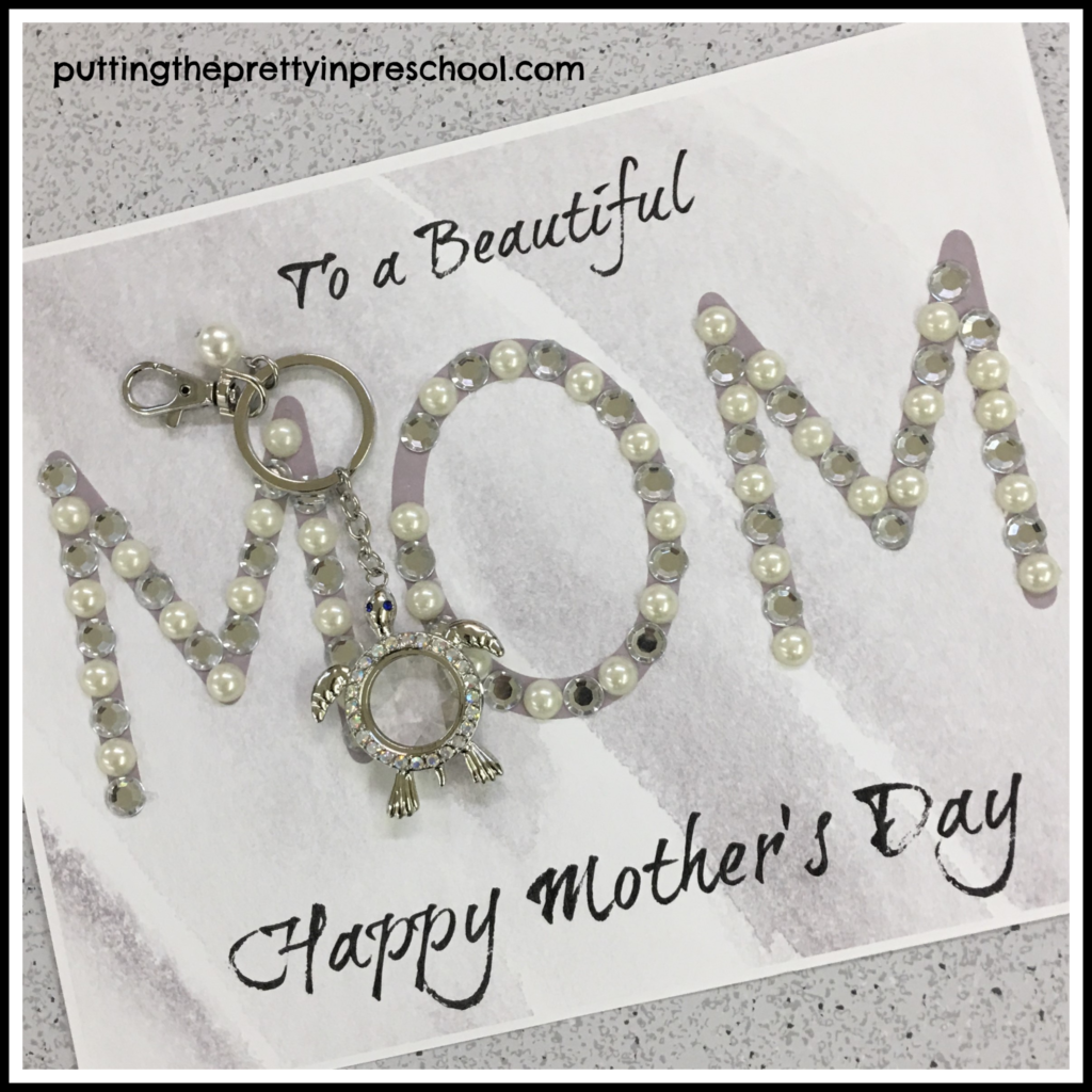 Mother's Day craft with sticker pearls and silver jewels added on the word 'mom.' A sea turtle key chain is added on as a gift. This craft is suitable for all ages.