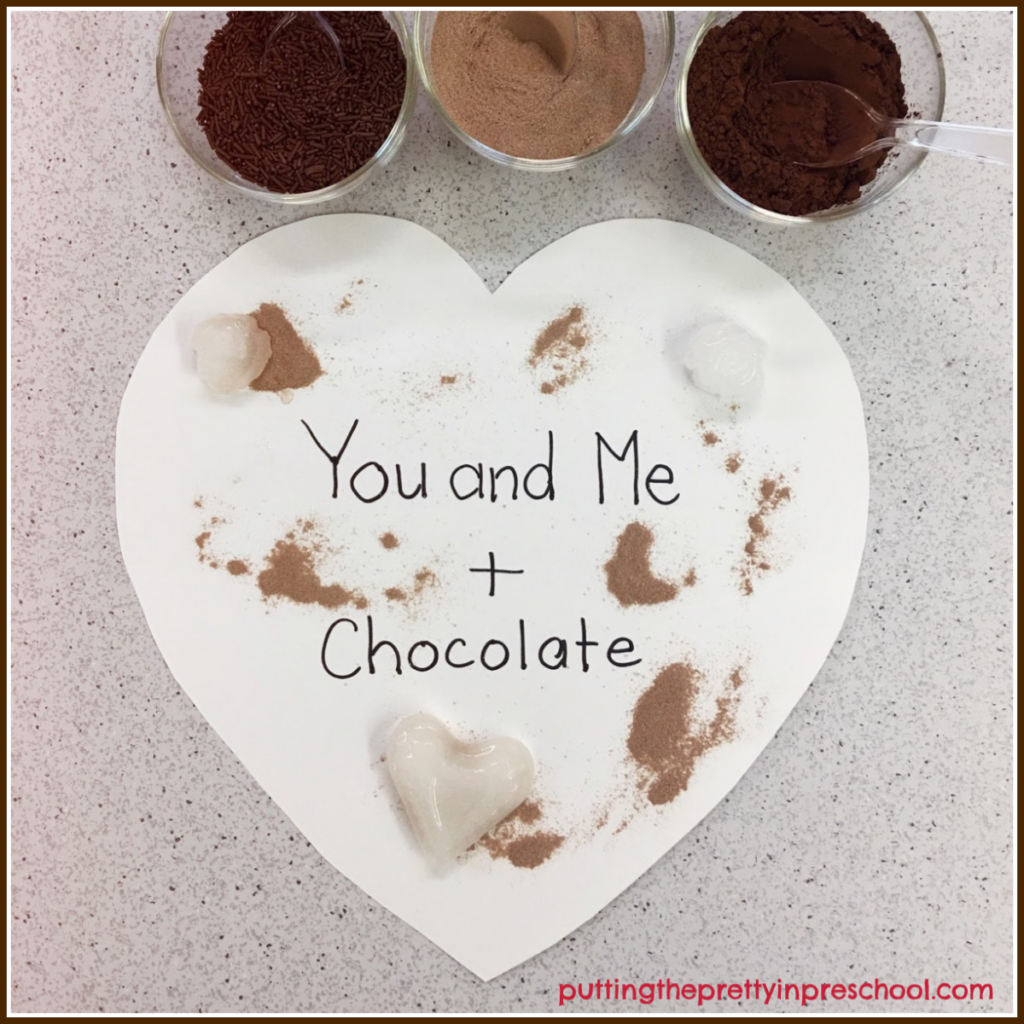 Painting activity using ice cubes to swish around cocoa, hot chocolate powder, and chocolate sprinkles.