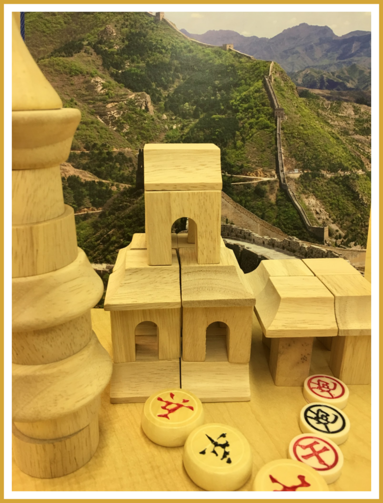 Oriental block play with game chip accessories set against a backdrop featuring the Great Wall of China. An activity perfect for a Chinese multicultural theme.