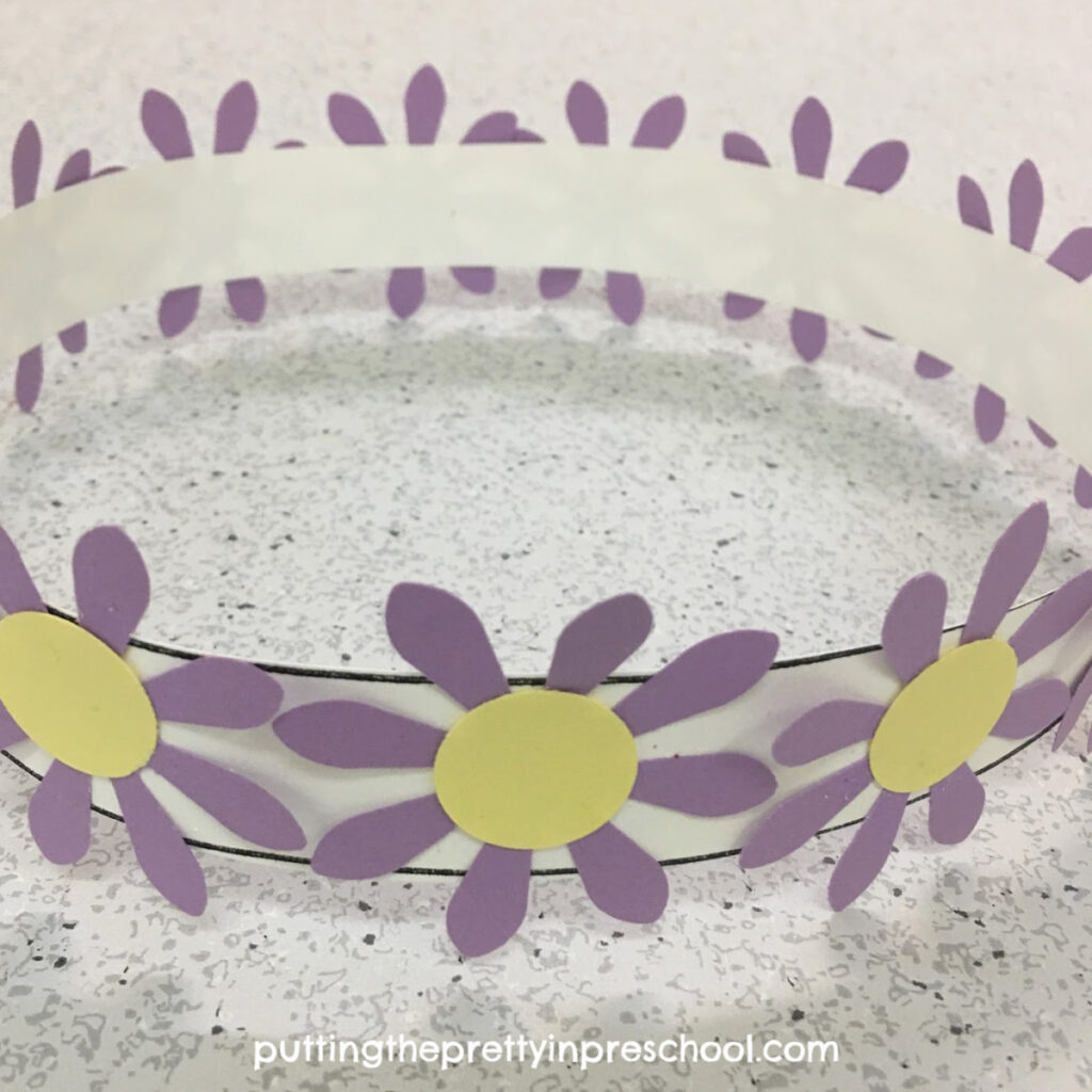 Craft crown with paper punched daisies.