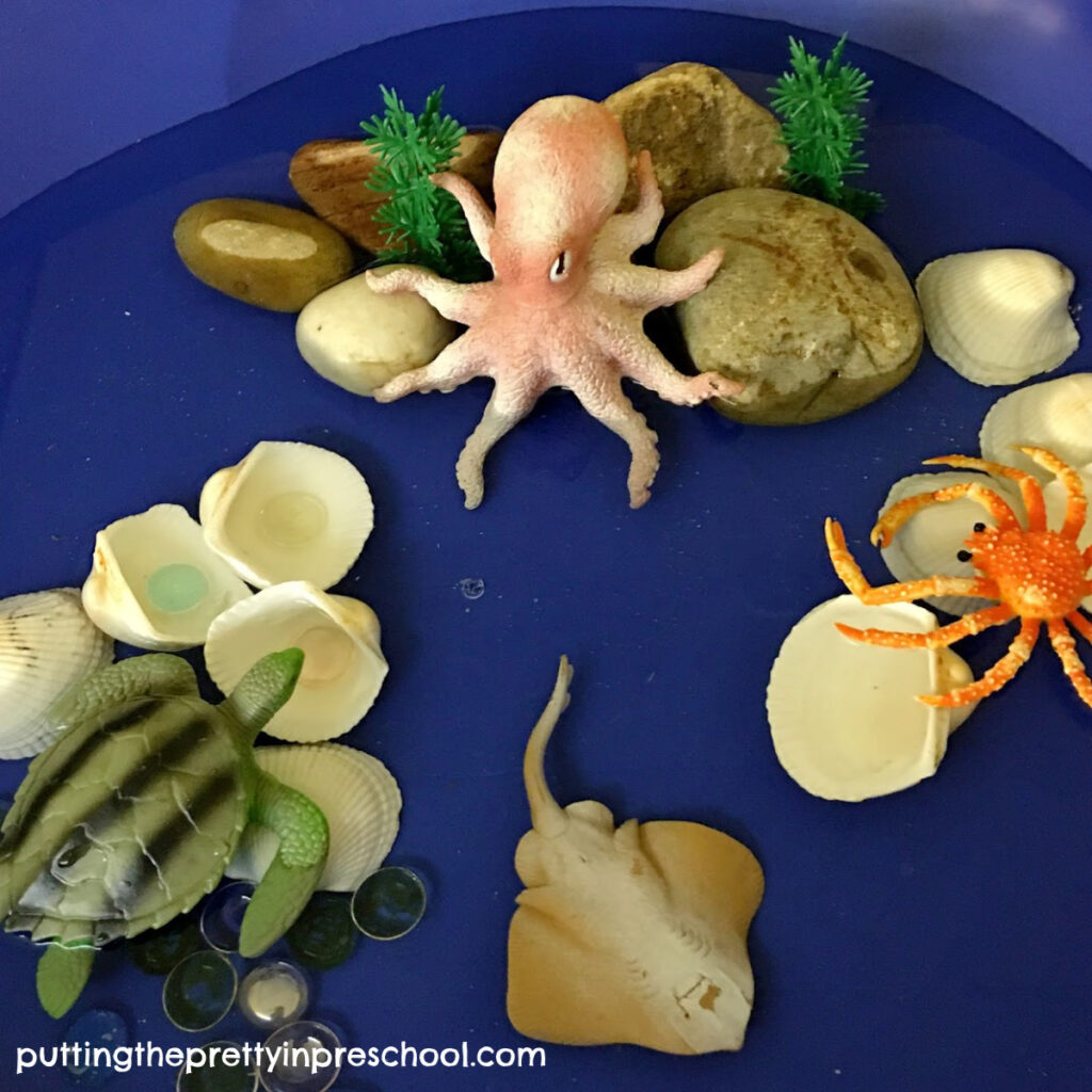 Invitation to add cheerios cereal to a painted octopus. All supplies for this craft are easily found in the kitchen. An all-ages art activity.