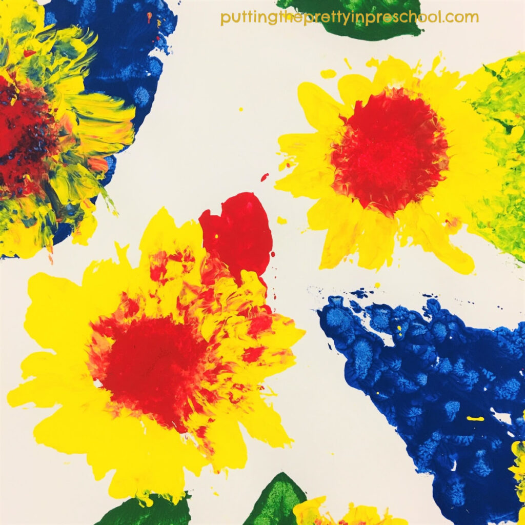 Paint prints with sunflowers. Tempera paint and primary colors used with leaves and heads of sunflowers. This is an all-ages activity.