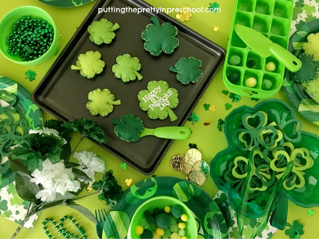 St. Patrick's Day house center dramatic play accessories. Tableware, play food, jewelry, coins, and decorations are included.