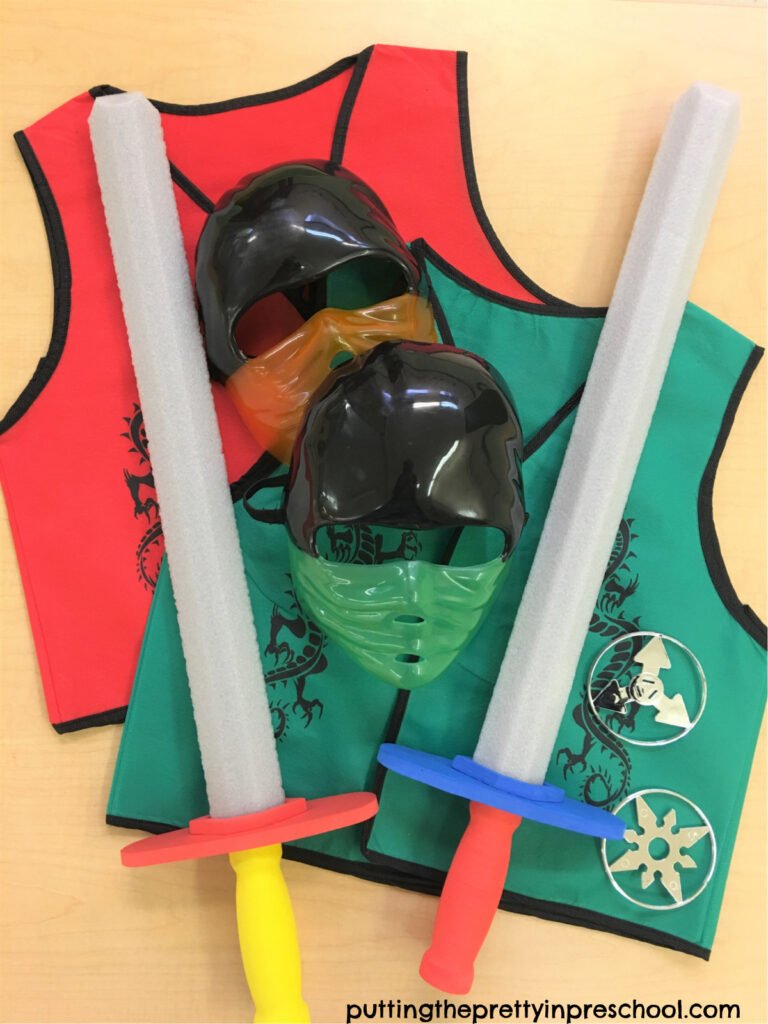 Ninja themed masks, vests, throwing stars, and foam swords for pretend play.