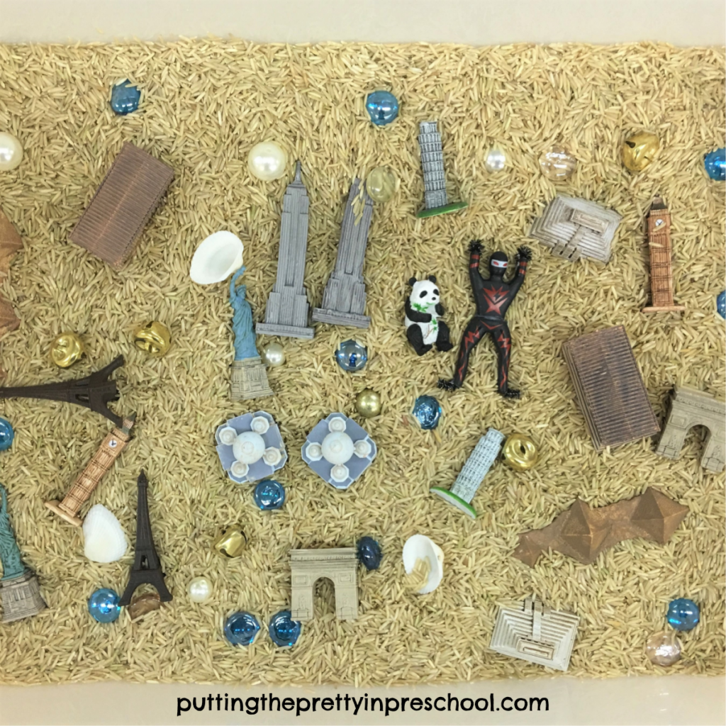 Ninja book-inspired rice sensory bin featuring Safari Toob "Around The World" figurines.