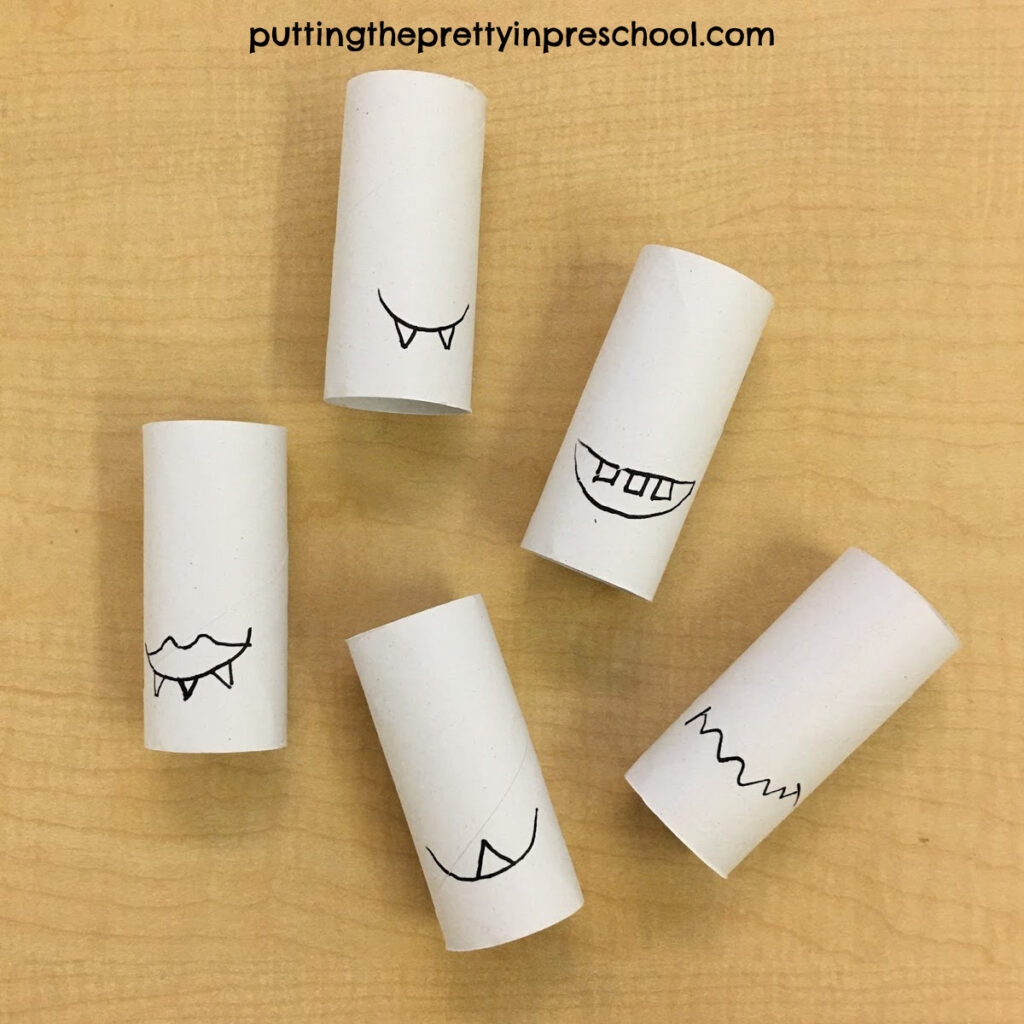 Mouths and teeth drawing on paper roll monsters.