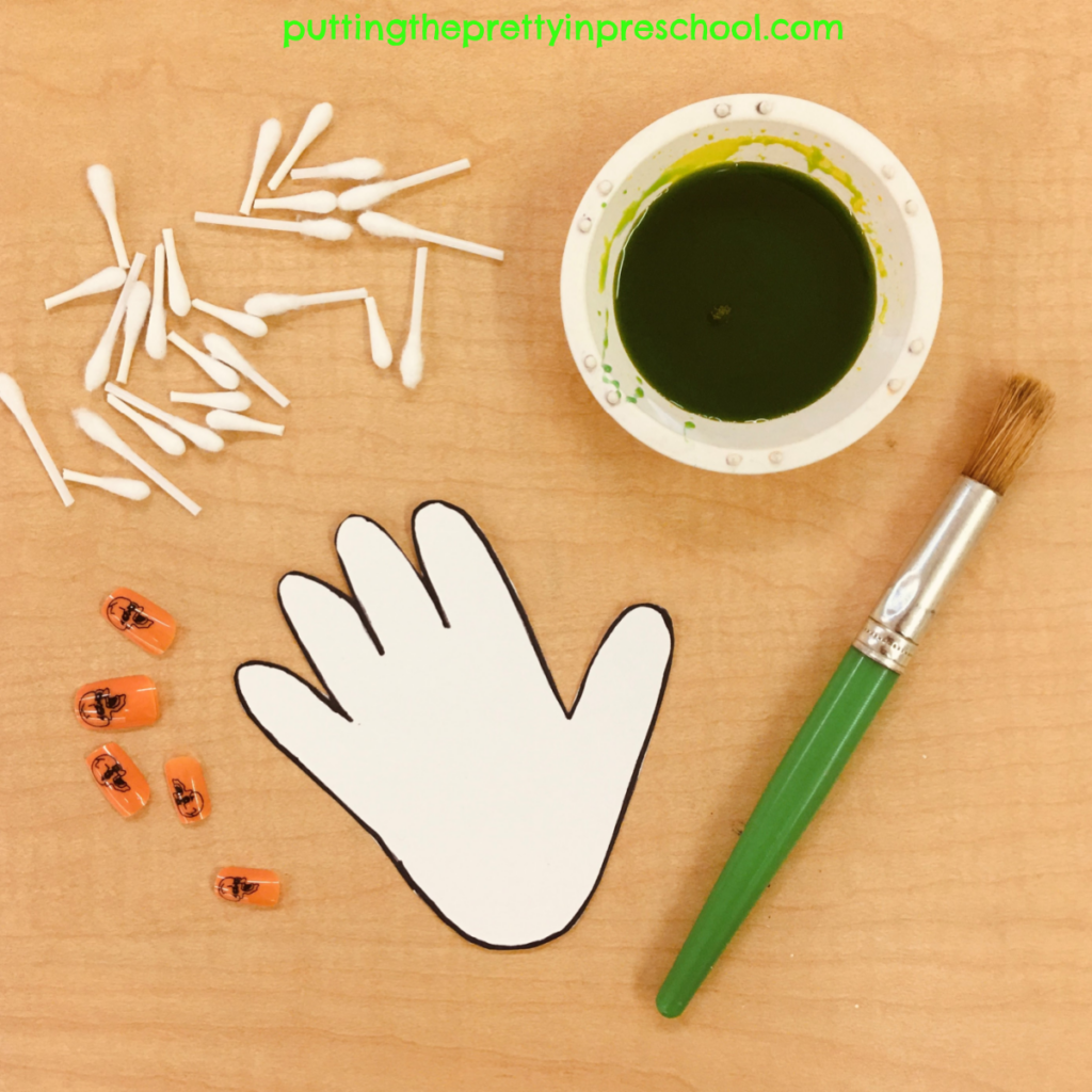 Supplies needed to create a green skeleton-themed painted hand.