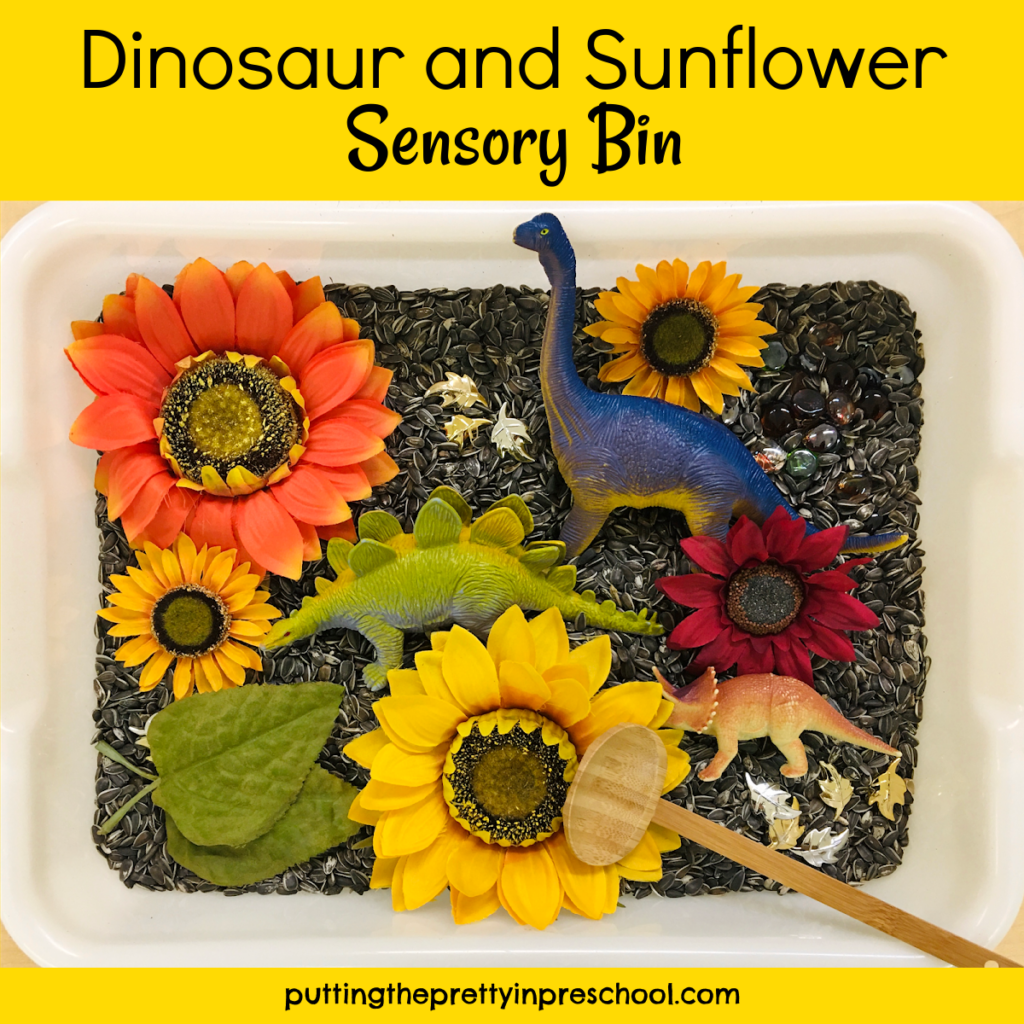 Dinosaurs mingle with sunflowers in a sunflower seed sensory bin.