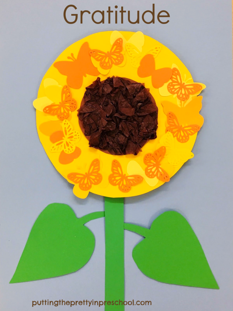Thanksgiving Day inspired easy to make butterfly sunflower papercraft. The sunflower head has a scrunched tissue center surrounded by paper butterflies.