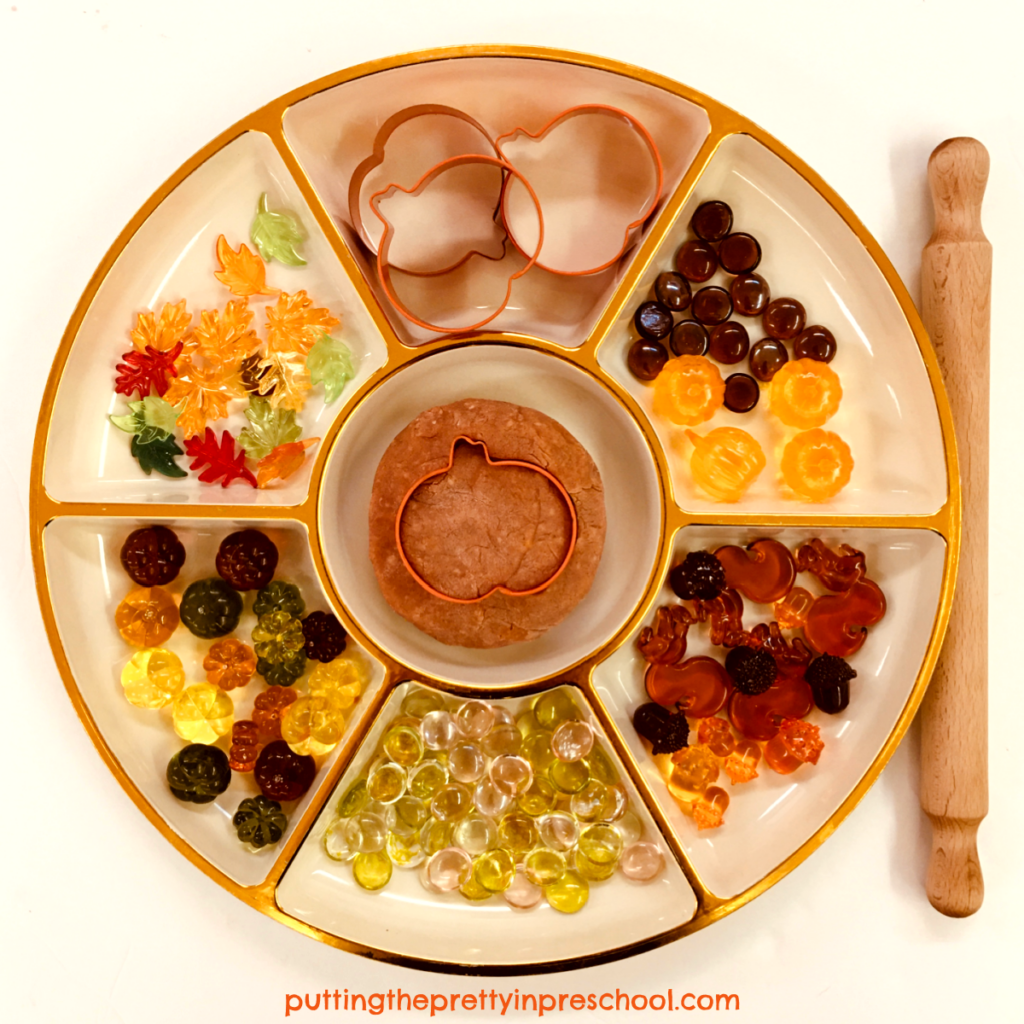 Fall-themed loose parts and pumpkin playdough.