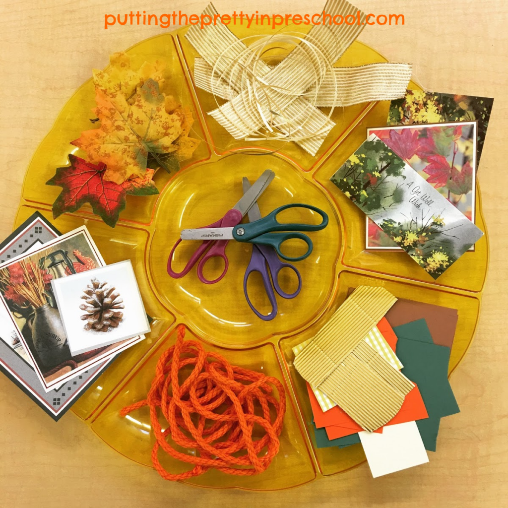 Scissor skills party tray with fall-themed craft supplies. Invitation to cut materials for collage.