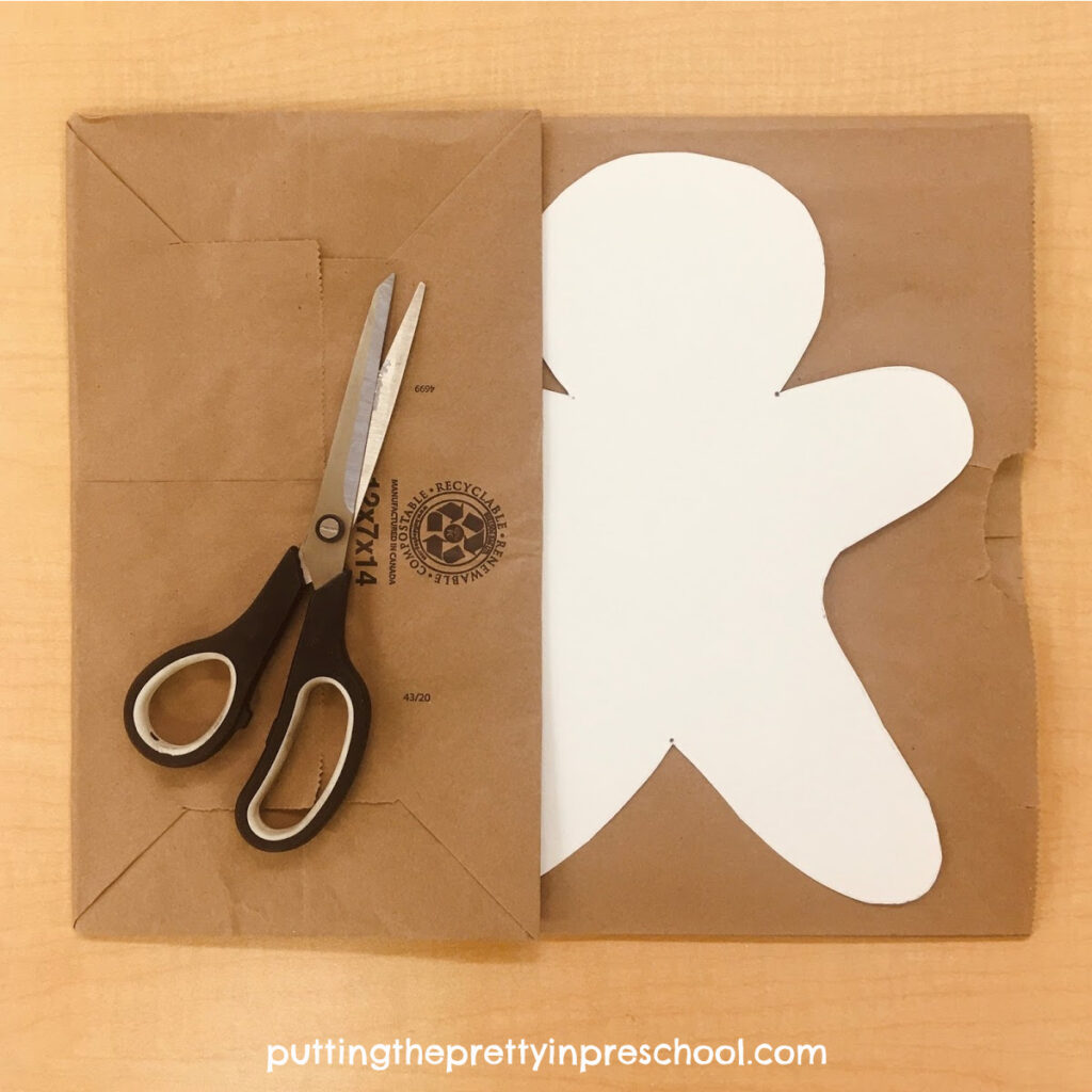 Paper bag ready to be cut into gingerbread men for a collage craft.