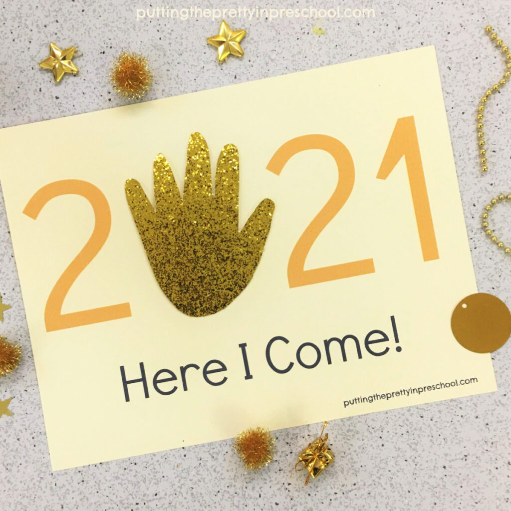 A gold glitter traced hand completes this 2021 keepsake craft.