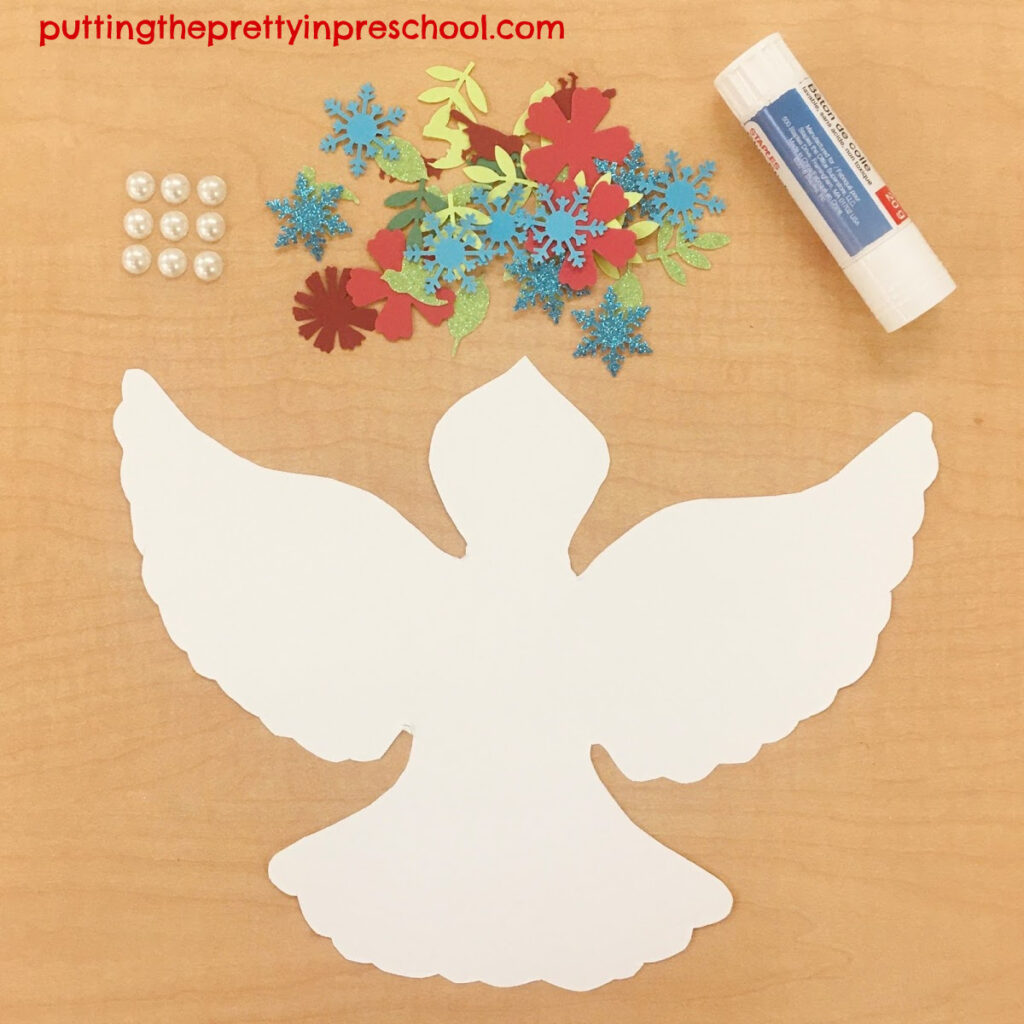Set up with adhesive pearls and snowflake, leaf, flower, and bird paper shapes to glue onto a paper dove.