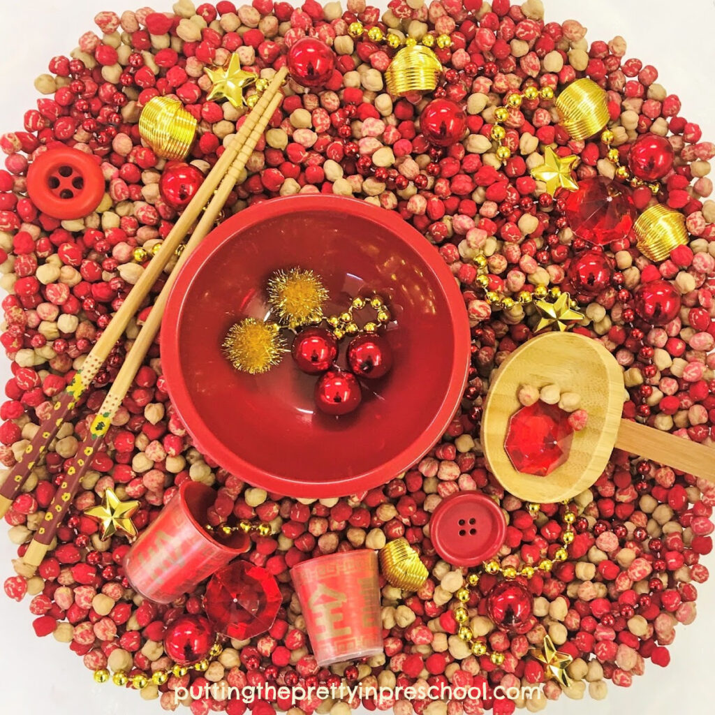 A chickpea-based Chinese New Year sensory bin.