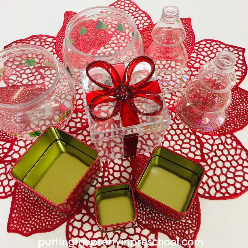 Christmas-themed containers for sensory play.