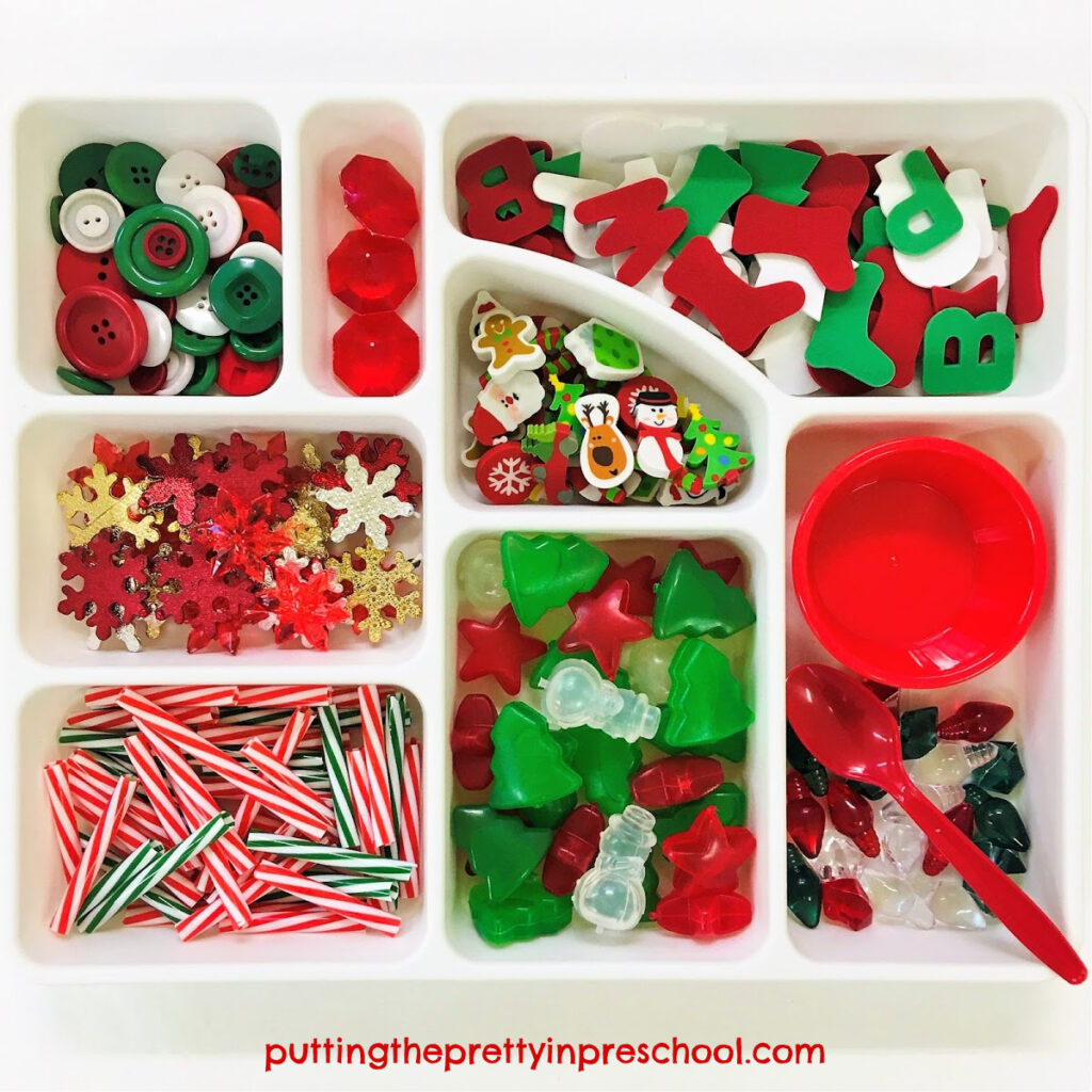 Christmas-themed loose parts tray for sensory play.