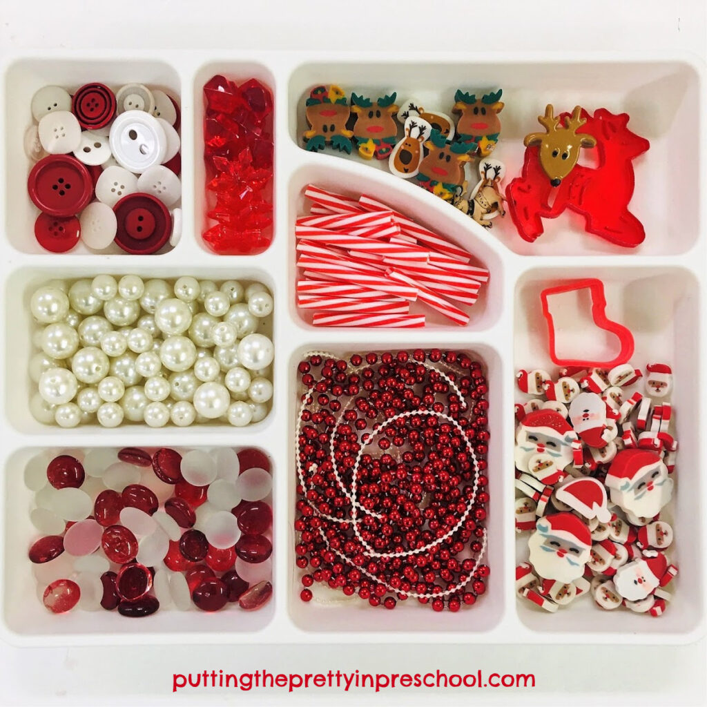 Red and white Santa Claus and reindeer themed loose parts tray.