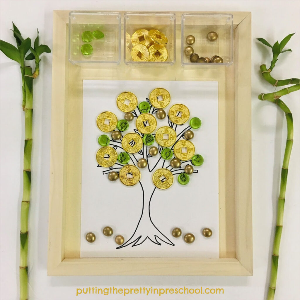 Invitation to decorate a Chinese money tree with gold coins and acrylic gems.
