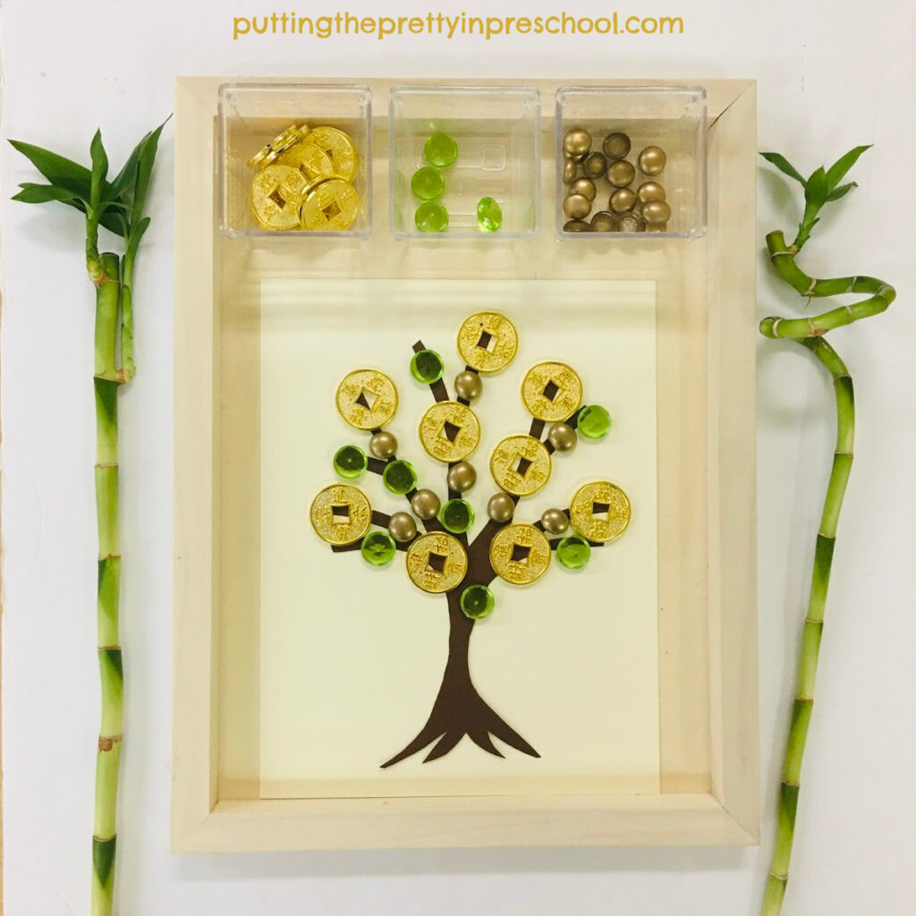 Invitation to decorate a Chinese money tree with gold coins and acrylic gems.