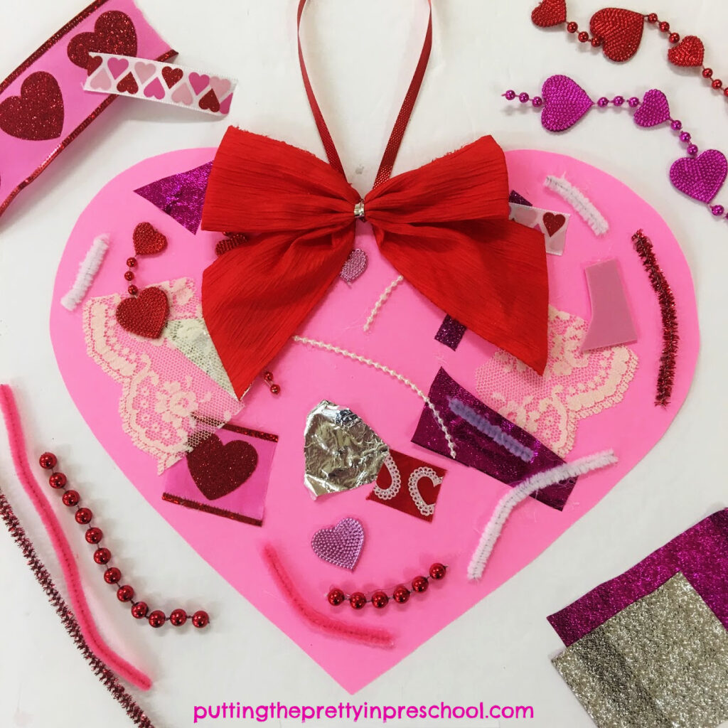 Scissor skill heart collage made by cutting and glueing luxurious craft supplies.