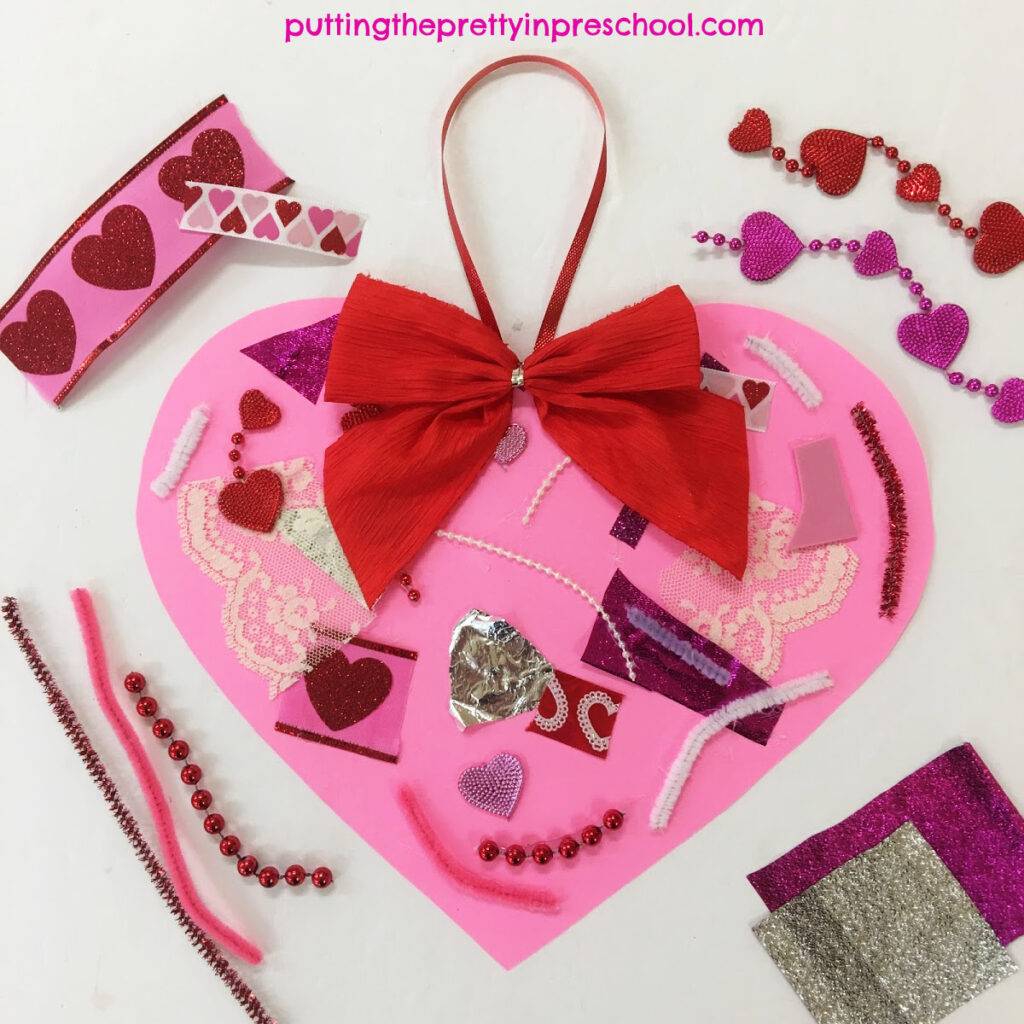 Scissor skill heart collage made by cutting and glueing luxurious craft supplies.
