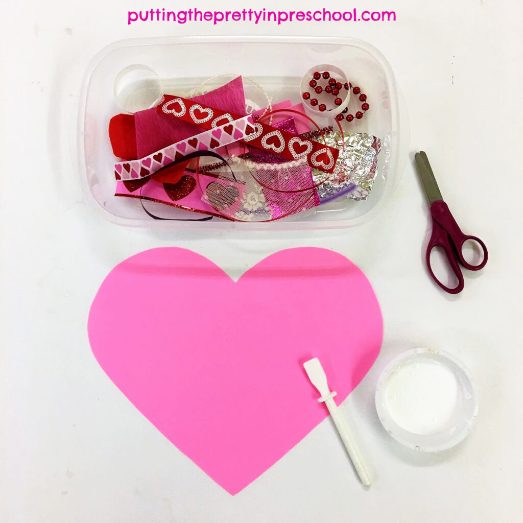 Invitation to cut and glue luxurious craft supplies to make a heart collage.