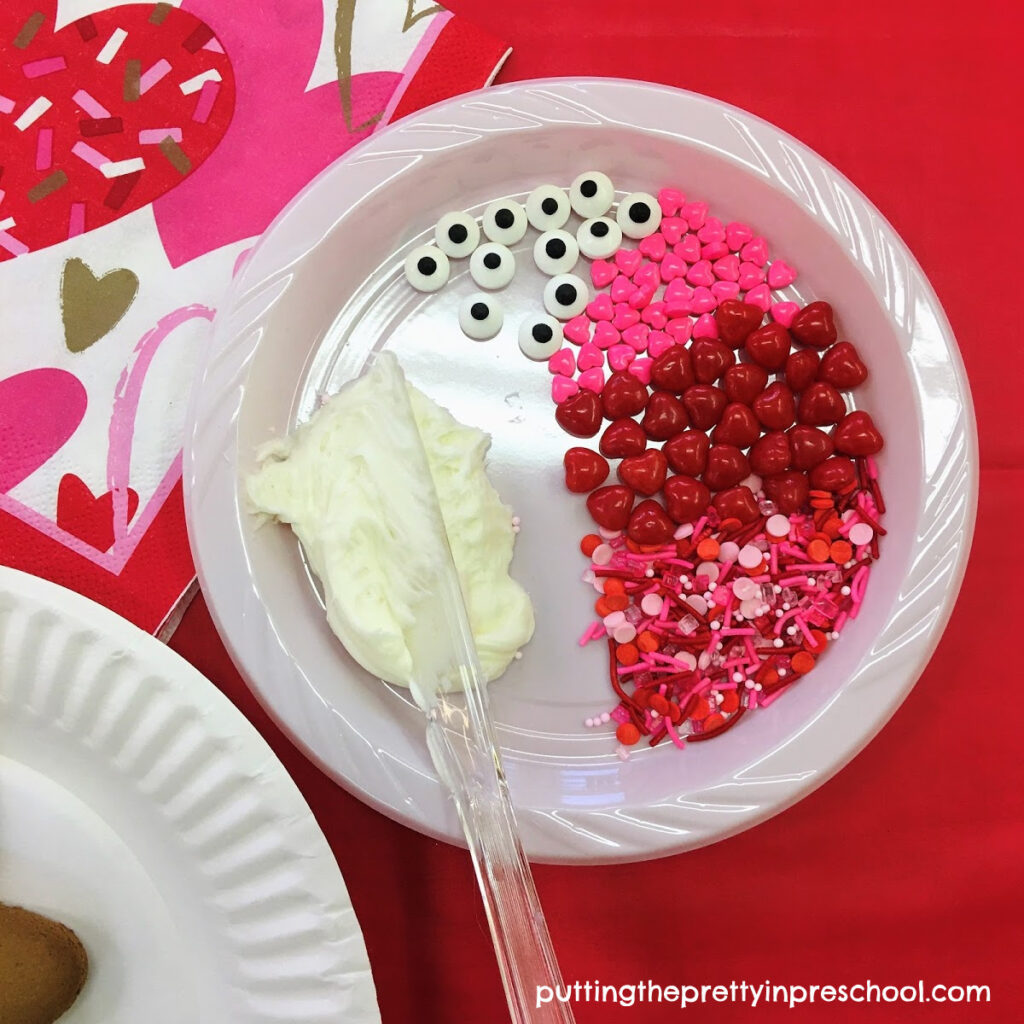 Heart and sprinkle decorations to decorate a Valentine's Day cookie.