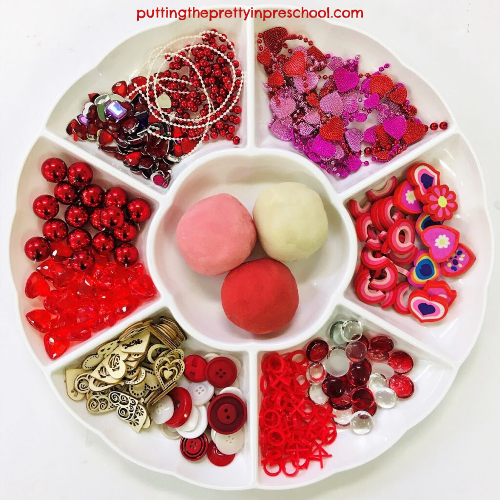 Valentine's Day-themed playdough and loose parts tray.