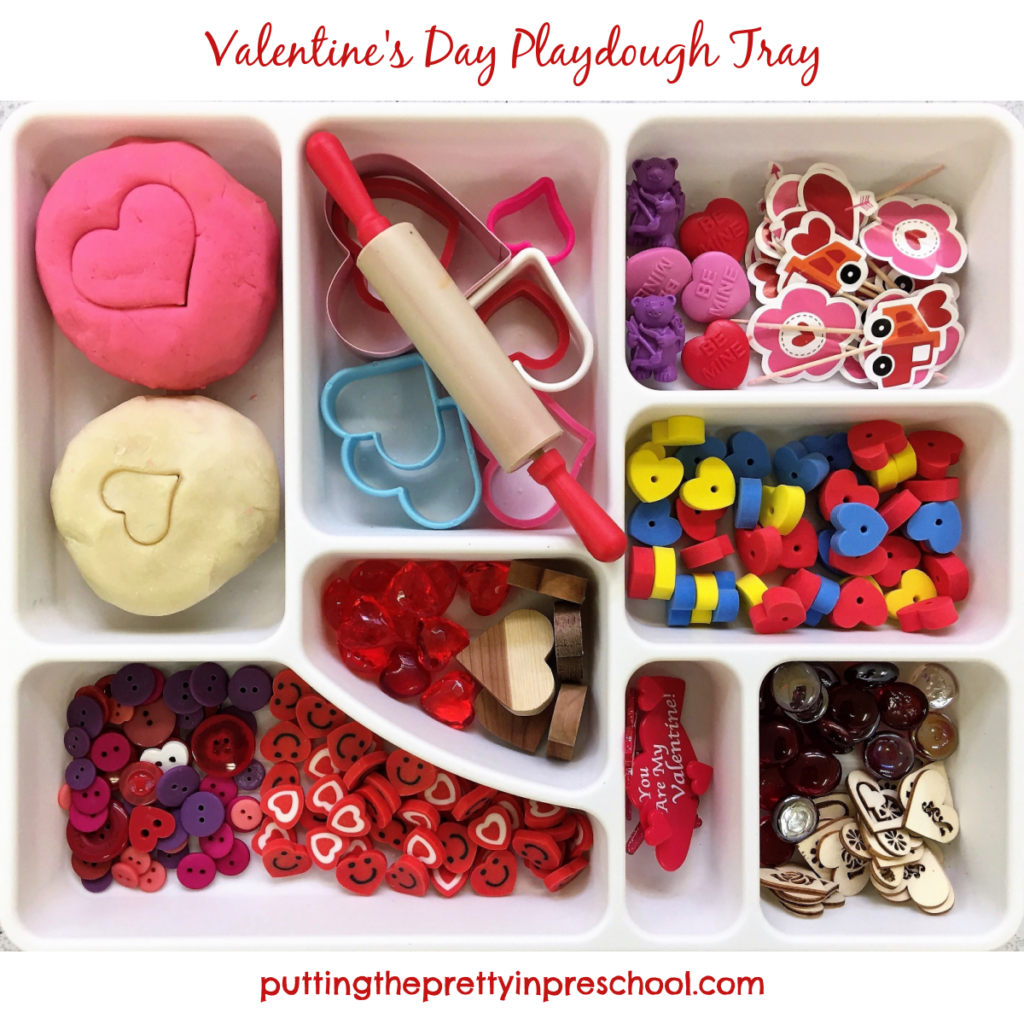 Valentine's Day playdough tray with loose parts and pink and white dough recipes.