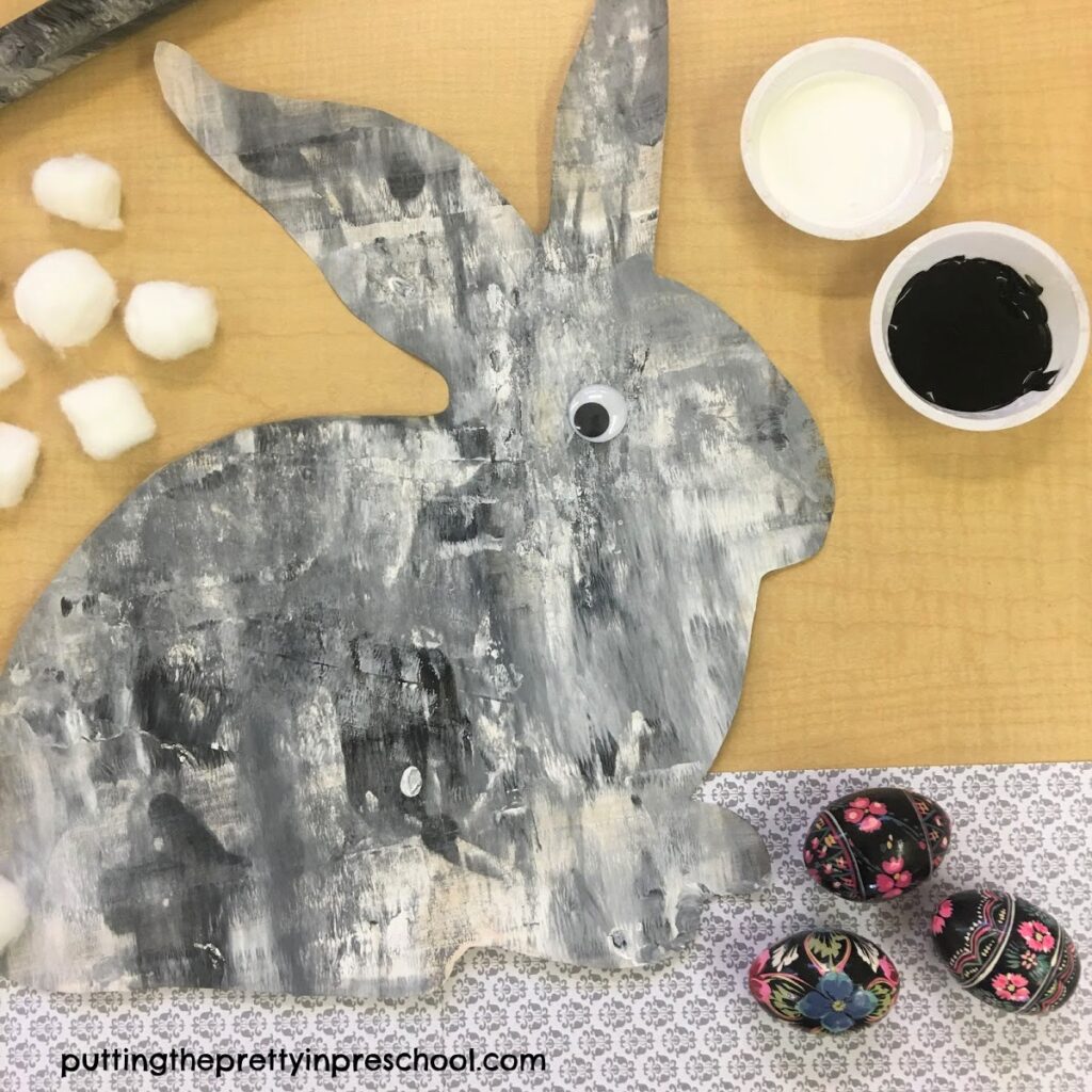 Black and white painted bunny using a rolling pin painting technique.