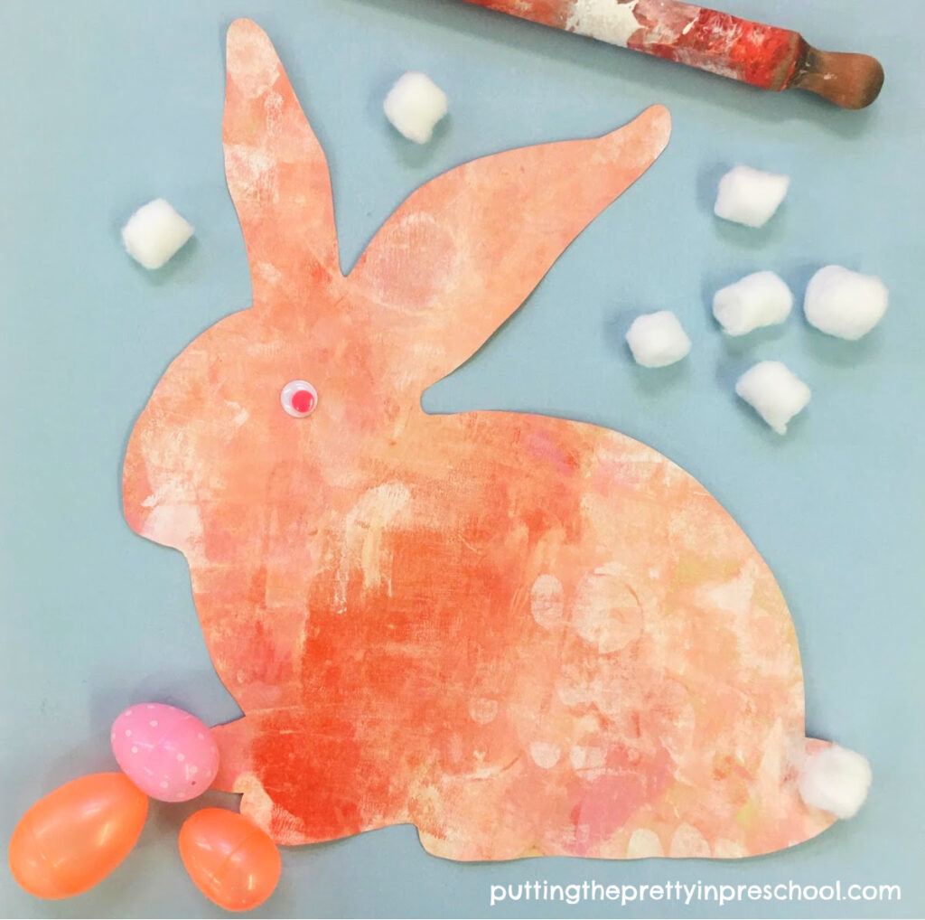 Cute coral-painted bunny using a rolling pin painting technique.