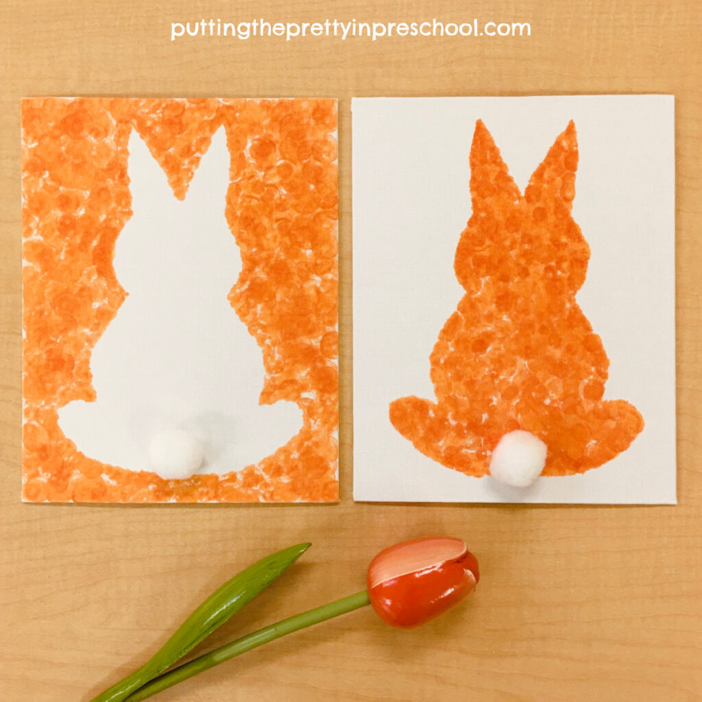 Silhouette bunny art made in two ways by dabbing spring-colored dot markers on a canvas. Free template included.
