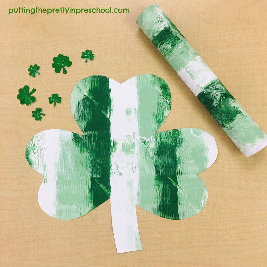 Paper towel roll painting on a shamrock.