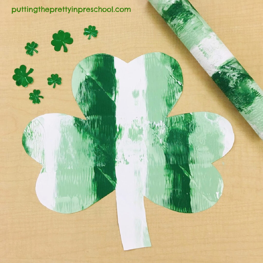 Striped shamrock paper towel roll art.