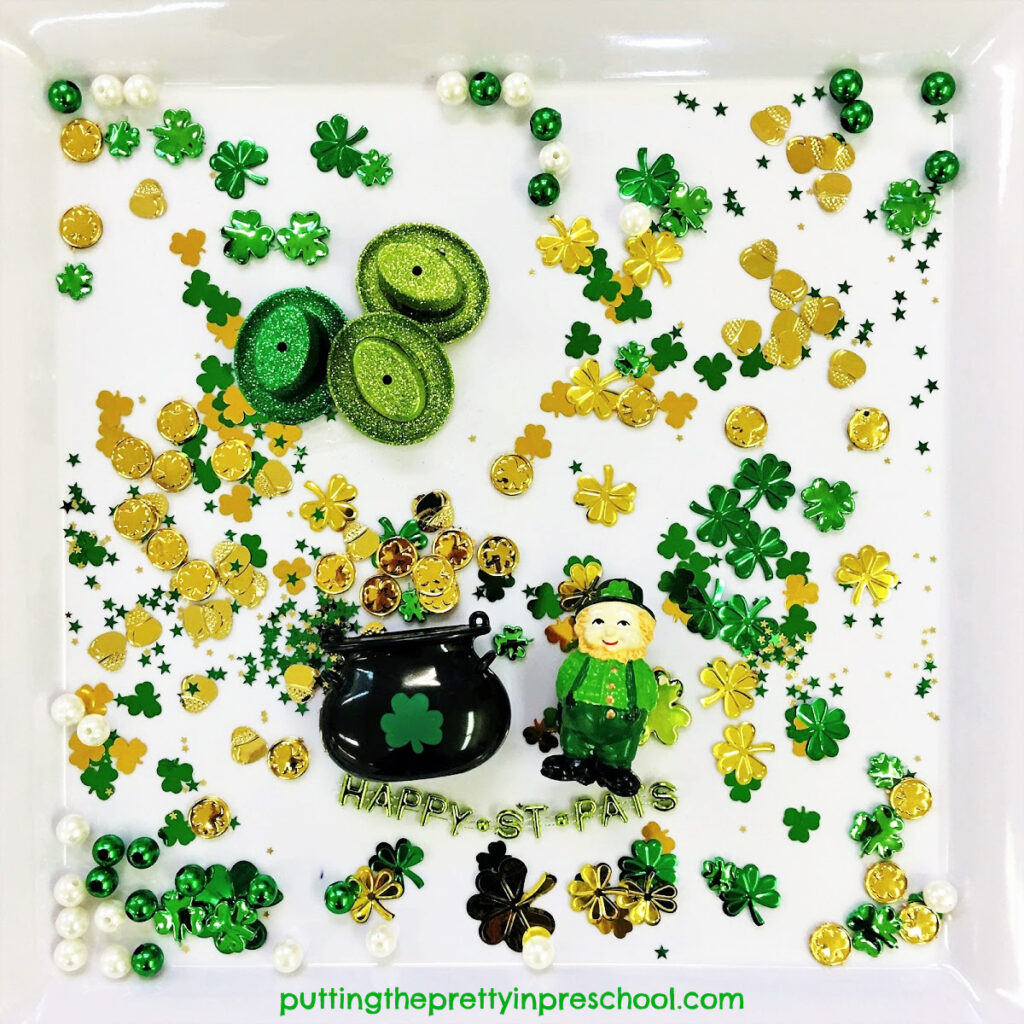 The leprechaun has plenty of gold to collect in this shamrock confetti-based St. Patrick's Day sensory tray.
