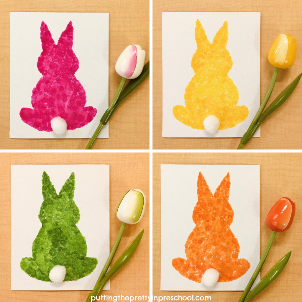 Adorable silhouette bunny art made by dabbing spring-colored dot markers on a canvas. Free template included. An art project for the whole family.