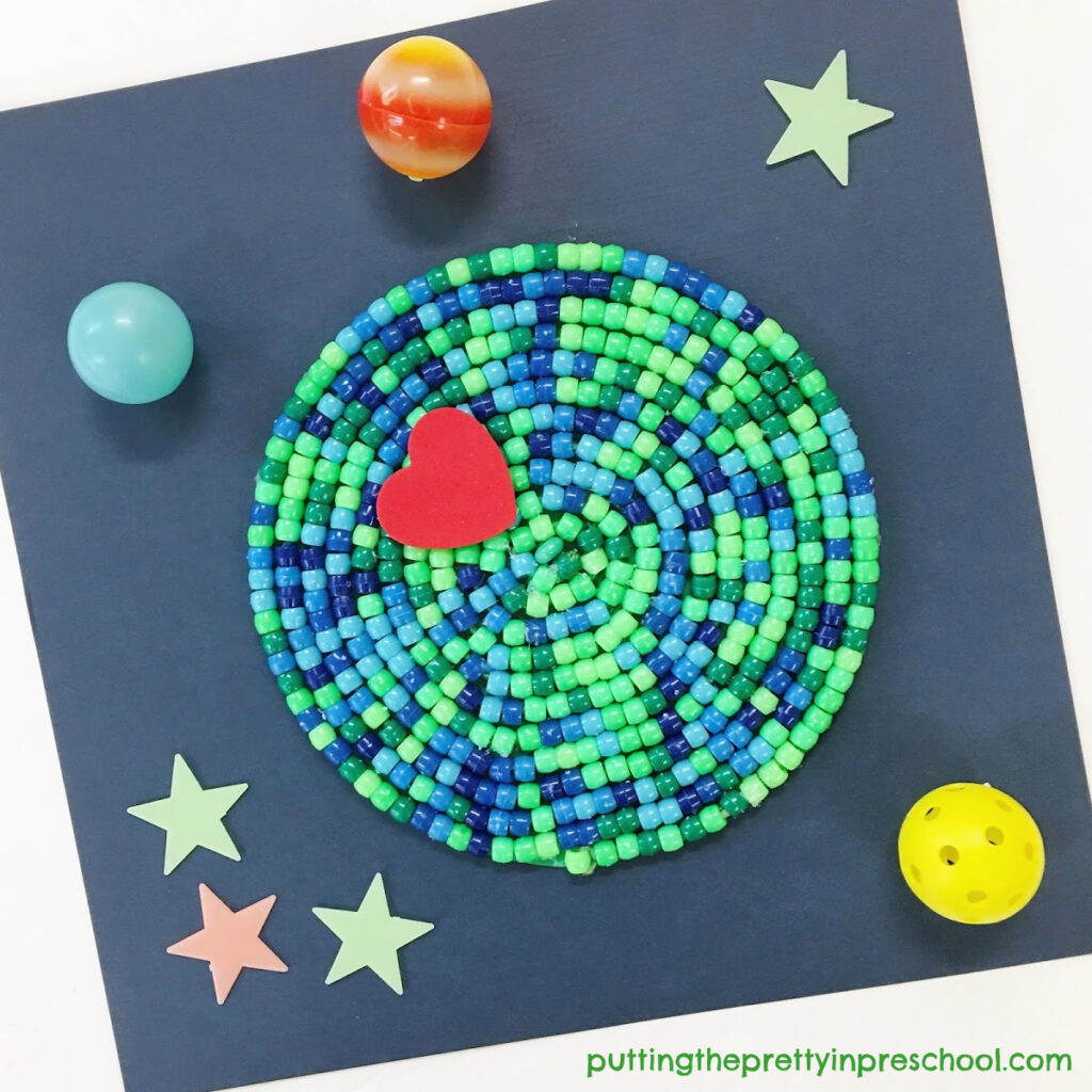 An attractive classroom or family earth day craft project with green and blue pony beads.