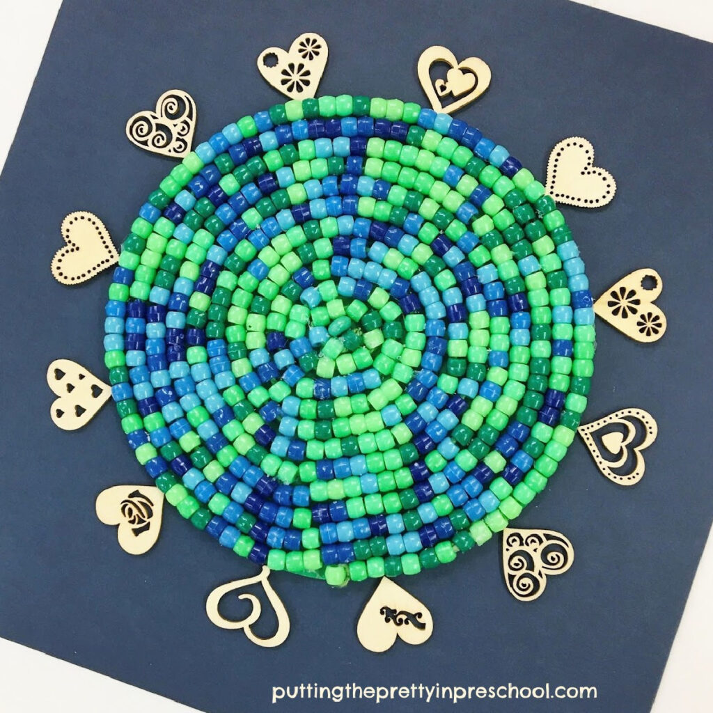 Exquisite earth day craft with green and blue pony beads. This easy-to-do activity works well as a classroom or family creative project.