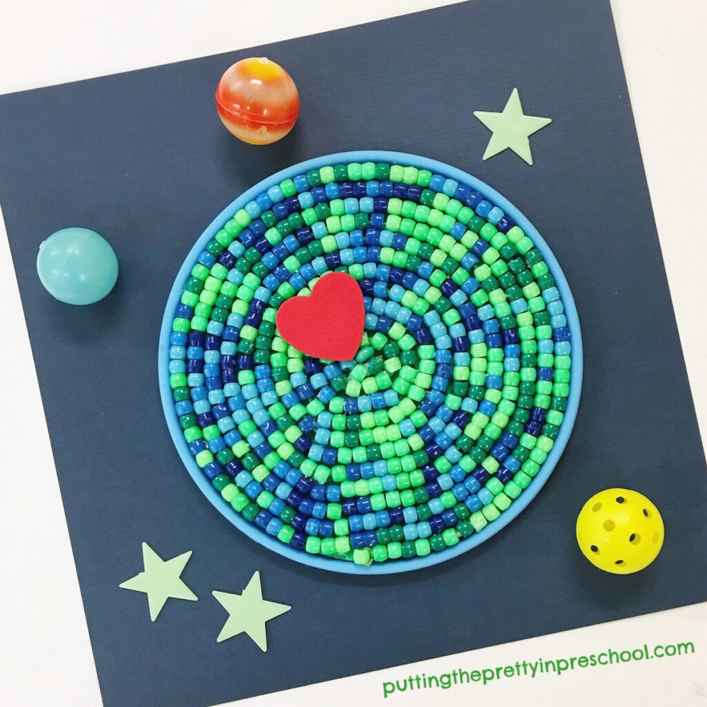 Stunning, super easy beaded earth day craft. This piece is framed and ready for display.