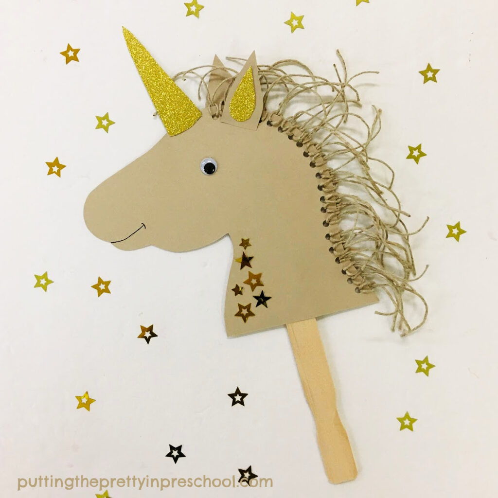 An easy-to-make, neutral-hued unicorn puppet with gold accents.
