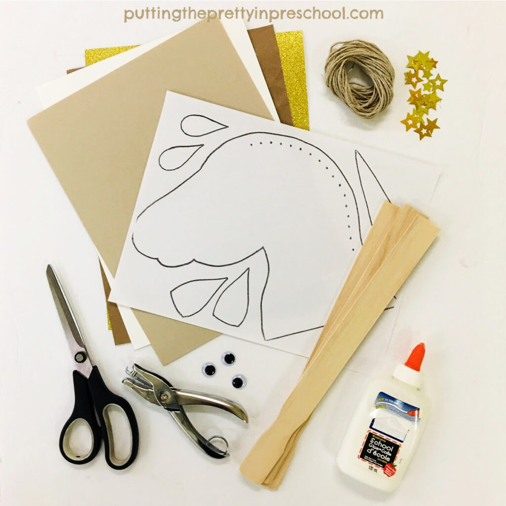 Craft supplies to collect in order to make a neutral-toned unicorn puppet craft.